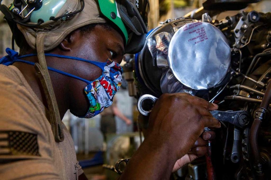 Military mechanic works on Electronic OEMs part
